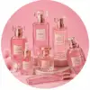 Luxury pink perfume bottles arranged on a rose backdrop at French Scents Dubai